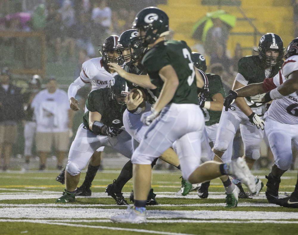 Glenvar's (21) Colby Street finds a hole up the middle as teammate (3) Colvin Delano looks for someone to block.